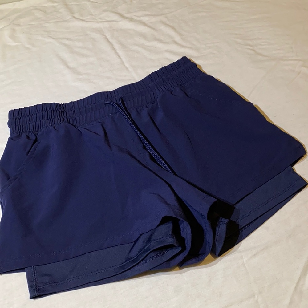 Size S blue lined work out shorts